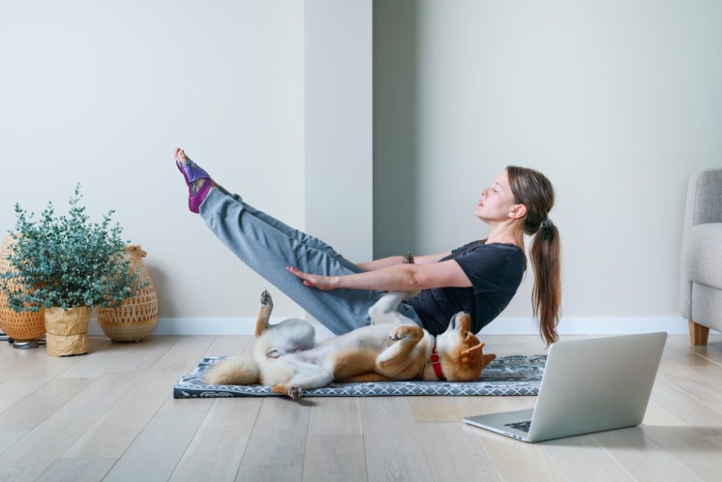 Keeping Your Senior Dog Active - dog doing yoga poses with woman