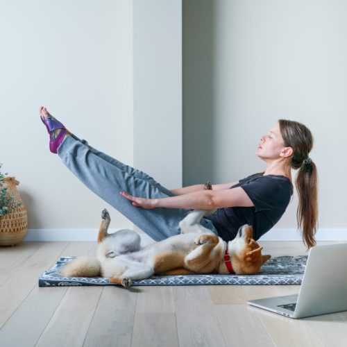 Keeping Your Senior Dog Active - dog doing yoga poses with woman